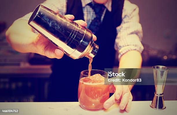 Bartender Is Making A Cocktail Toned Stock Photo - Download Image Now - Drink, Mixing, Retro Style