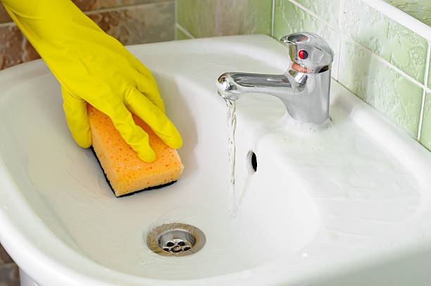 istock Bathroom sink faucet cleaning 466105306