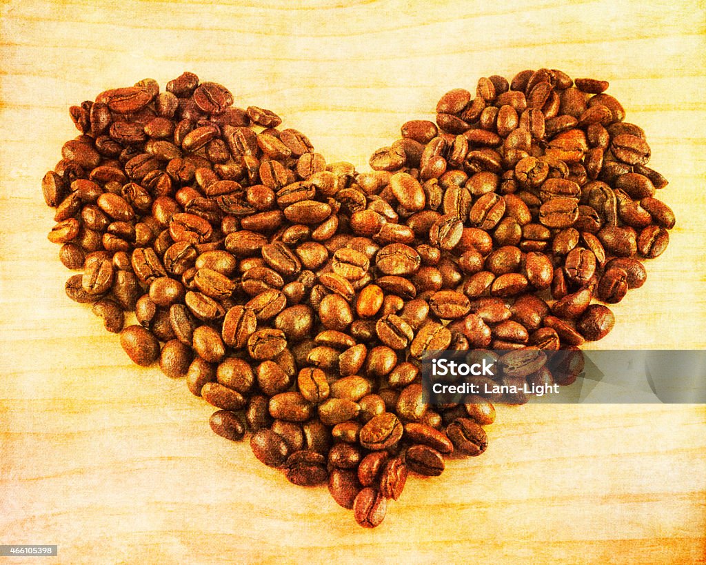 Coffee heart on wooden background Coffee heart on wooden background with vintage postcard style 2015 Stock Photo