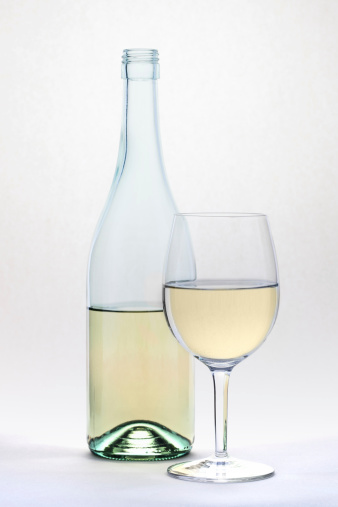 White wine glass and bottle islolated on white background