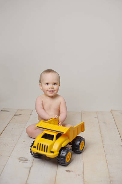 istock Baby Playing with Toy Truck 466106671
