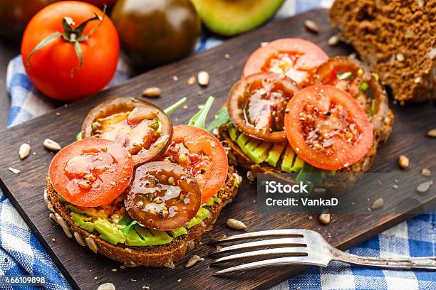Avocado Sandwich With Tomatoes Stock Photo - Download Image Now - 2015, Arugula, Avocado
