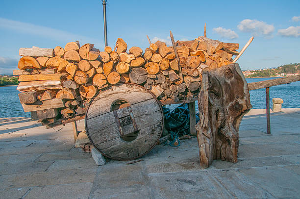 Old wooden wagon, loaded with logs