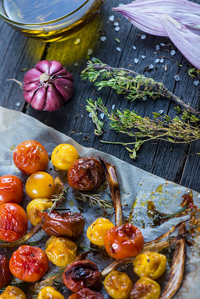 istock Freshly roasted vegetables with herbs on wooden table 466110372