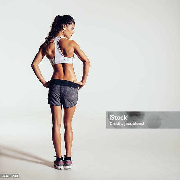 Healthy Young Woman In Sportswear Stock Photo - Download Image Now - Rear View, Back, Women