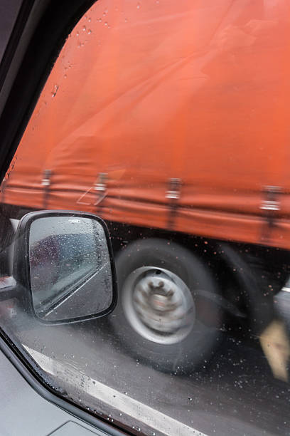 istock passing a truck in the rain 466114323