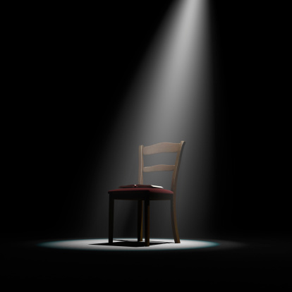 Chair with an open book on stage. Cg-image.