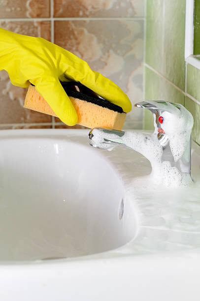 istock Bathroom sink faucet cleaning 466116126