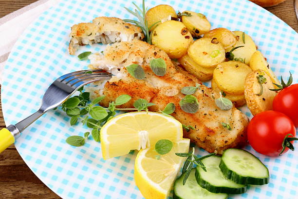 istock Rosemary potatoes with fried fish fillet 466116178