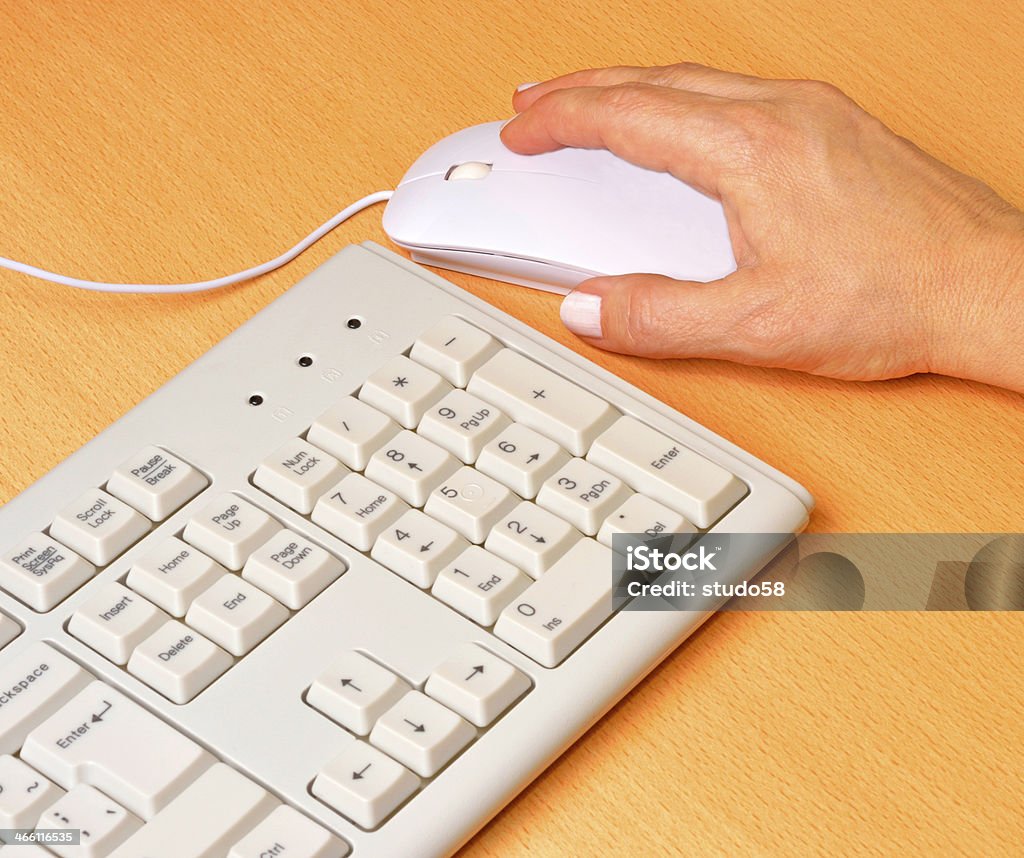 human hand human hand on computer mouse Business Stock Photo