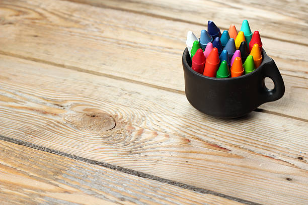 istock Black mug with oil pastel crayons 466117066