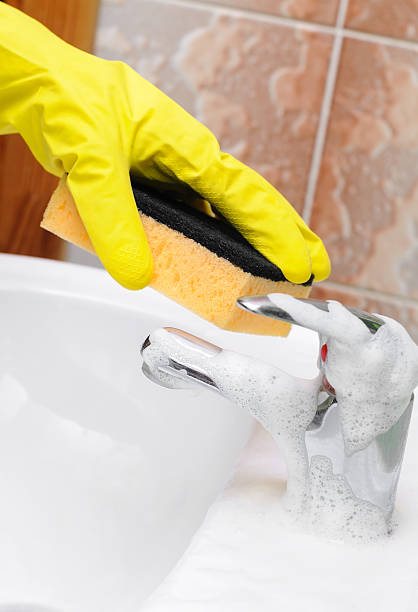 istock Bathroom sink faucet cleaning 466117516