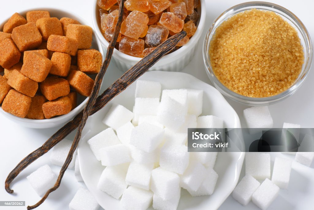 Various types of sugar Still life of various types of sugar in bowls 2015 Stock Photo
