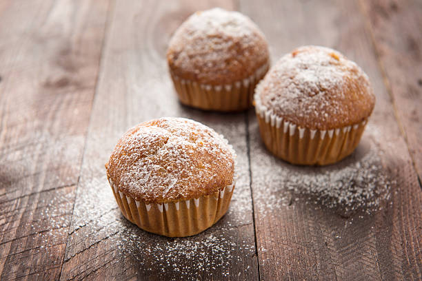 istock Homemade muffins on a wooden table 466123236