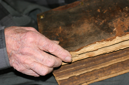 Old Man's Hand on Slovak Bible