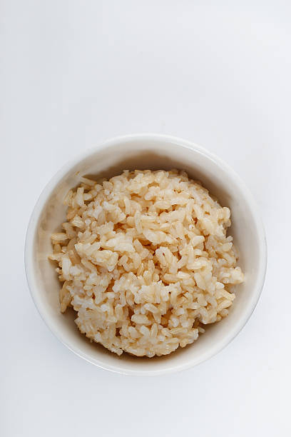 arroz integral - brown rice fotos fotografías e imágenes de stock