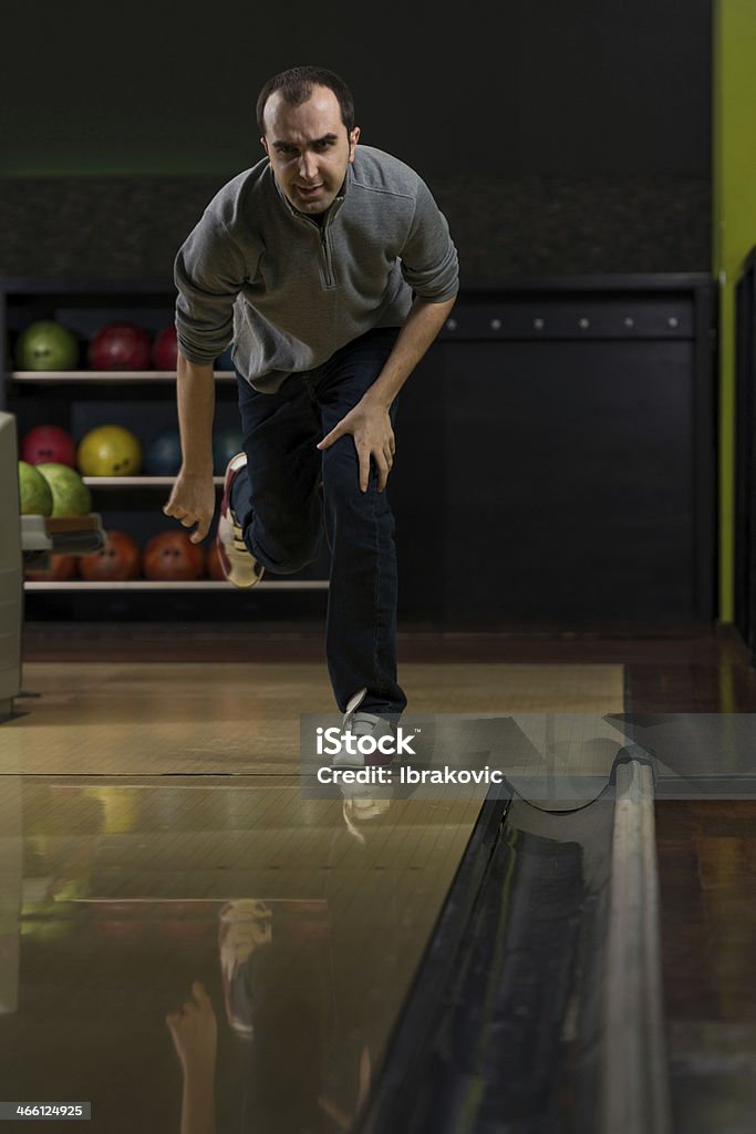 Bowler Attempts To Take Out Remaining Pins Taking Aim And Getting Ready To Bowl The Winning Frame Active Lifestyle Stock Photo