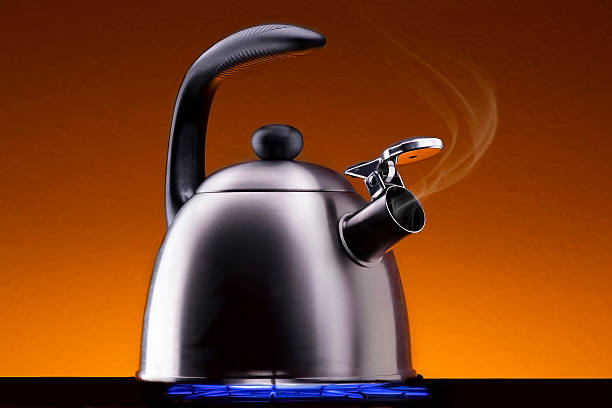 istock Tea Kettle with Steam Over A Hot Gas Stove 466125282