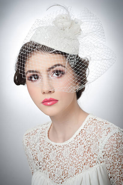 istock Cute brunette with white cap and veil, studio shot 466125356