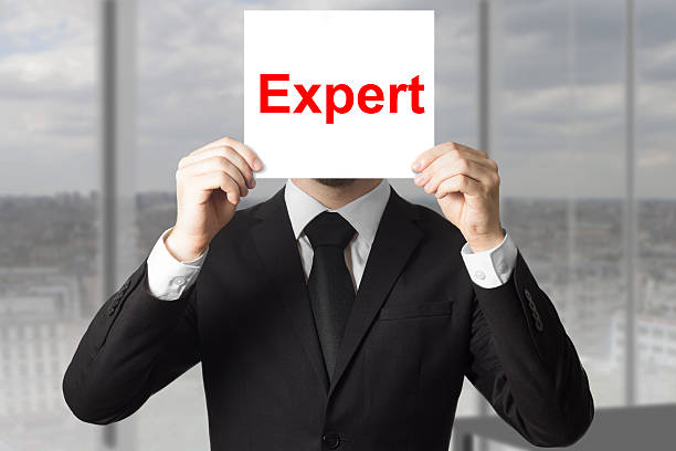 istock businessman hiding face behind sign expert 466125432