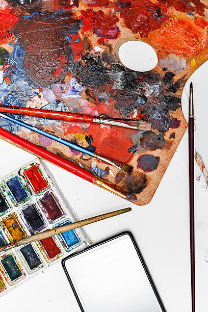 istock Brush and watercolor paint cell phone on paper 466128550
