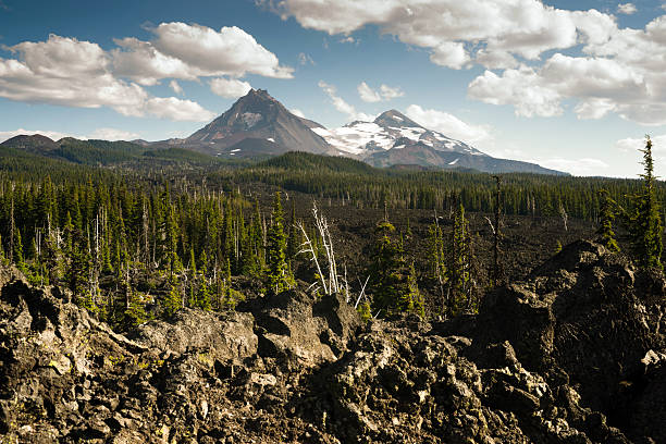 A seemingly endless field of lava leads out to the Sisters near Bend Oregon