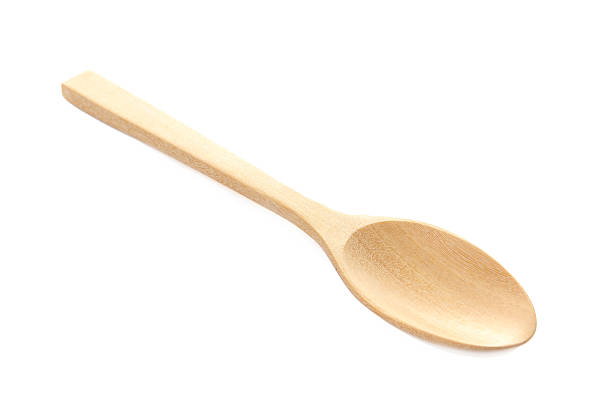 istock wooden spoon isolated over white. 466136372