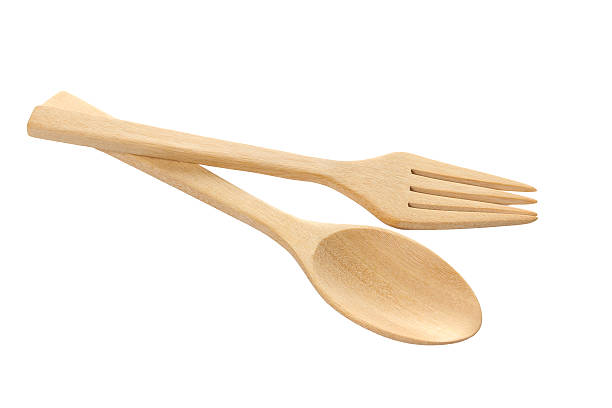 istock wooden spoon isolated over white. 466136390