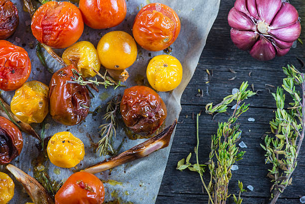 istock Freshly roasted vegetables with herbs on wooden table 466139758