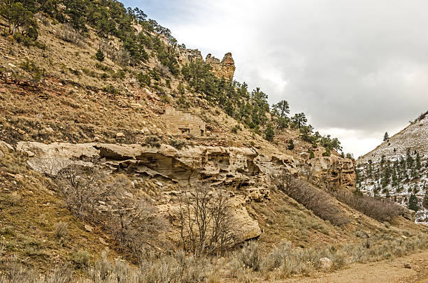 Old Building Blending Into the Hillside Blending into the hill in a Utah ghost town is part of a stone building. carbon county utah stock pictures, royalty-free photos & images