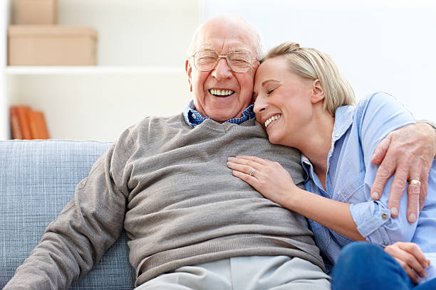 istock Loving father and daughter together on sofa 466144313