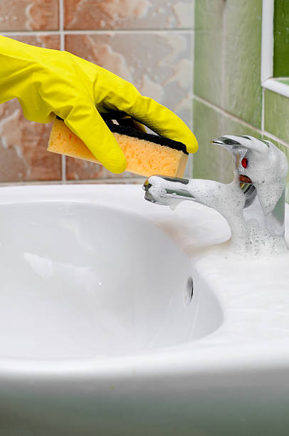 istock Bathroom sink faucet cleaning 466146078
