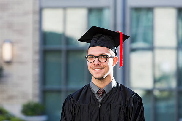 istock Teenage boy at high school graduation 466146372