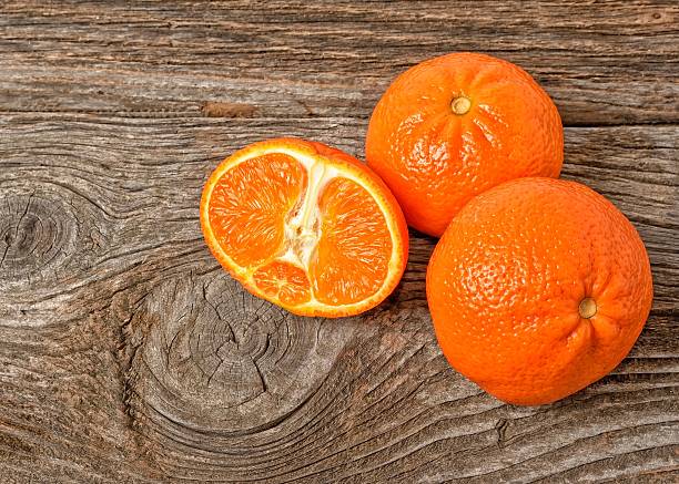 istock fresh oranges on a wooden background 466146422