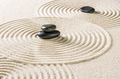 Japanese zen garden with black pebbles