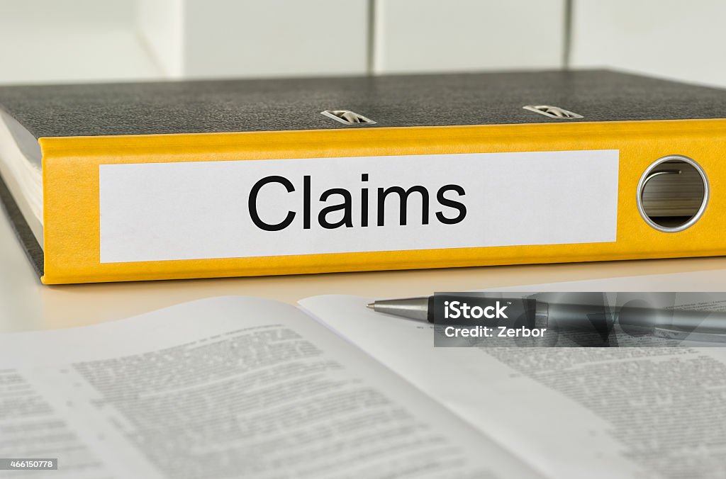 Folder with the label Claims Claim Form Stock Photo