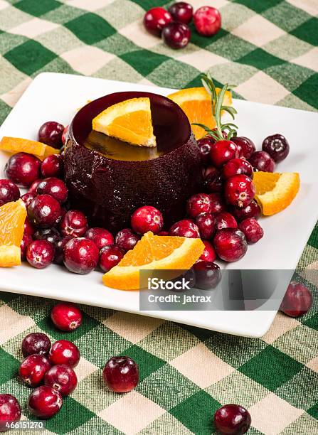 Jellied Cranberry Sauce With Orange Wedges And Rosemary Stock Photo - Download Image Now