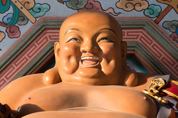 schöne glückliche-buddha. - buddha laughing guru smiling stock-fotos und bilder