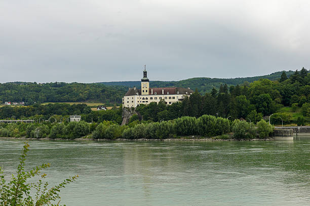 old histroical building by danube river near grein at austria old histroical building by danube river near grein at austria grein austria stock pictures, royalty-free photos & images