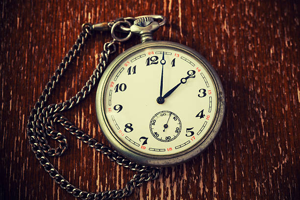 istock Old clock on vintage wooden background 466154360