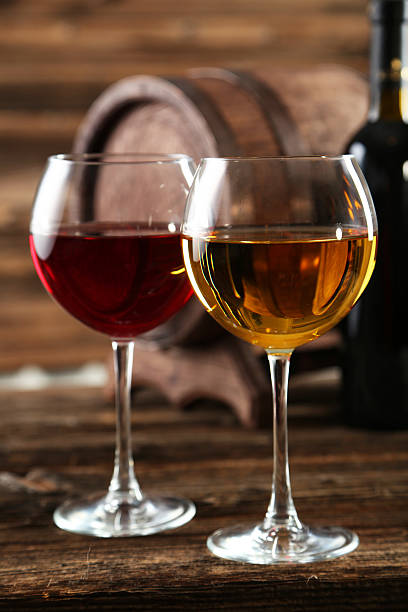istock Red and white wine glass with bottle and barrel 466155012