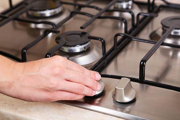 istock Female hand turn on gas stove 466159098