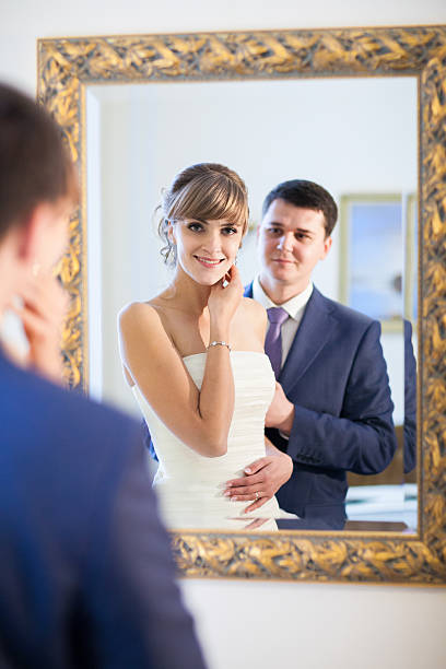 istock couple at the mirror 466160059