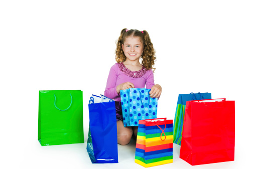 The girl and many color paper packages.