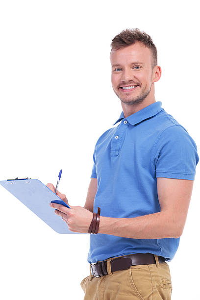 istock young man fills out a form 466160634