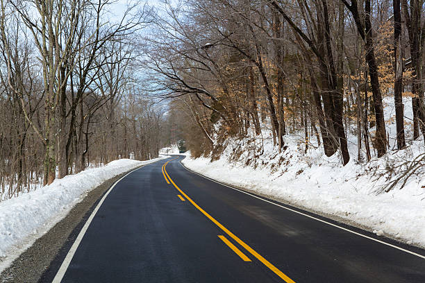 istock Beautiful Windy Country road after a fresh snow 466163656