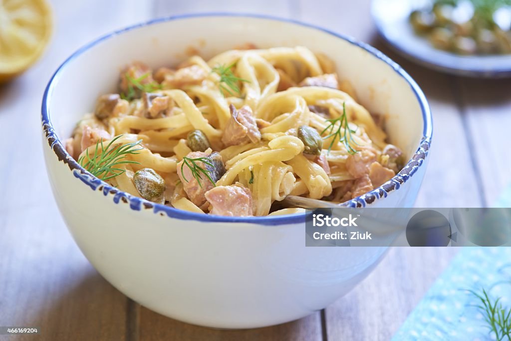 Pasta with smoked salmon and capers in cream sauce Pasta with smoked salmon and capers in cream sauce, italian cuisine Pasta Stock Photo