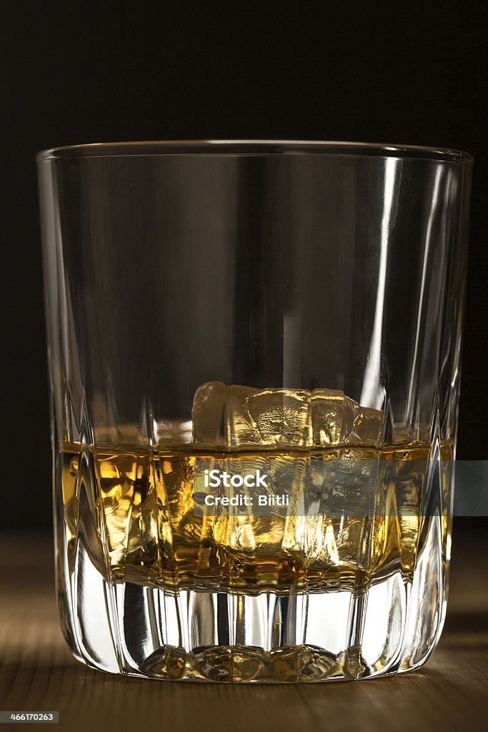 Whiskey on the rocks whiskey tumbler with ice cubes  backlit Alcohol - Drink Stock Photo