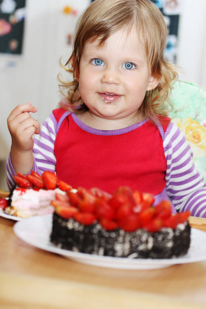 istock happy girl with cake 466170933