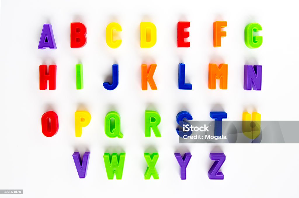 Alphabet letter, magnetic letter, text, child, magnet Alphabet written in colorful plastic magnetic letters on a white background. Letter Magnet Stock Photo